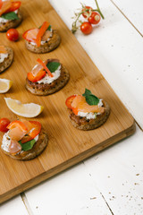Blinis in wooden vintage table.