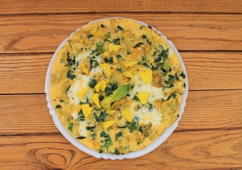 Omelet with spinach cooked in olive oil
