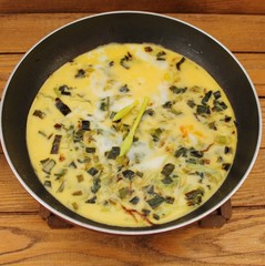 Omelet with spinach cooked in olive oil
