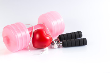 Fitness background with dumbbell, handgrip and heart