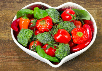 Fresh vegetables in a heart shape plate.