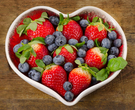 Berries in heart shaped bowl.