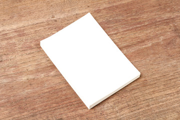 Blank paper with empty space mock up on wood background