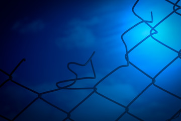 Broken Wire Fence and Blue Sky Background