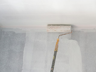 painting a wall and ceiling with roller