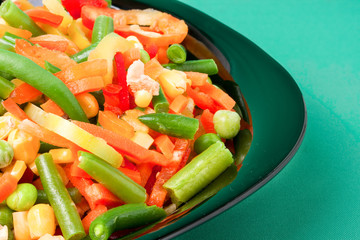 raw vegetable mix on the yellow plate