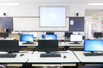 Defocused student study computer classroom for background.