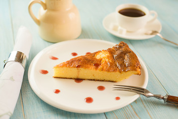 A piece of cottage cheese cake on a white plate