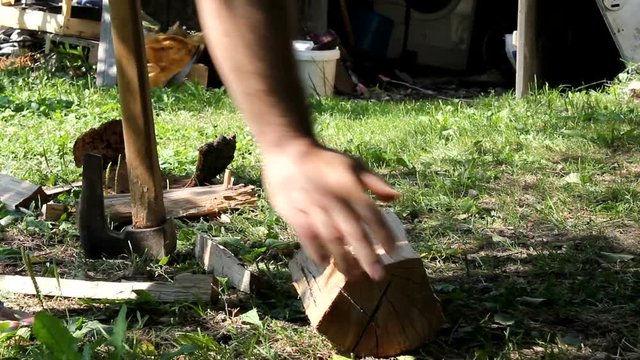 Man Chopping Wood Outdoors With Axe, HD 