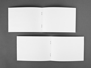 Blank opened magazine isolated on grey background