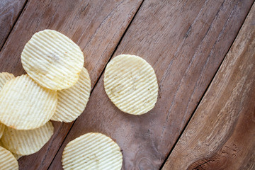 potato chips over wooden table