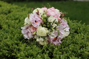Wedding bouquet on the green bush