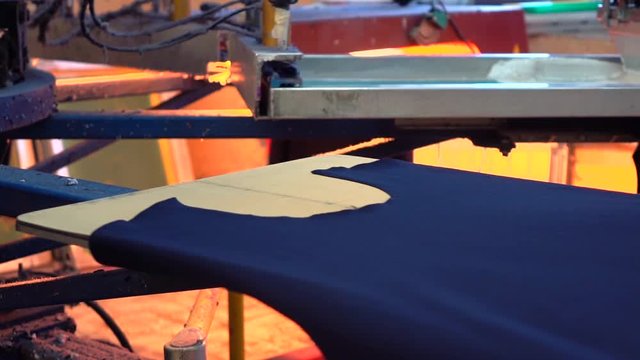 Industrial silk screen printing machine in action