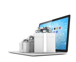 Gift box with ribbon bow on laptop keyboard. 3d rendering.