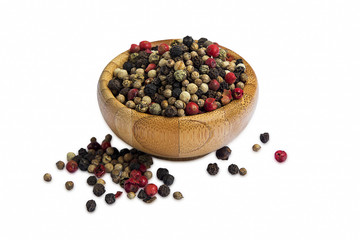 Pepper seeds in wooden bowl isolated