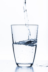 water splashing from glass isolated on white background