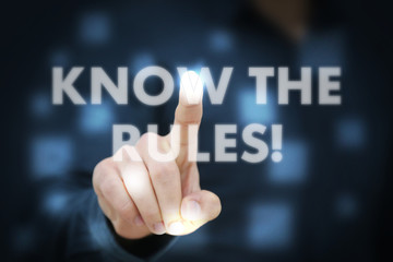Businessman touching Know The Rules!