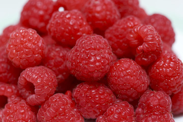 Fresh raspberries in white dish
