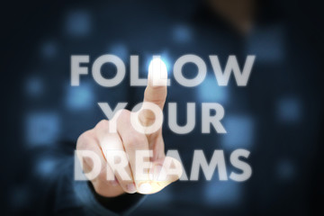 Businessman touching Follow Your Dreams