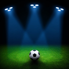 Soccer ball on green stadium