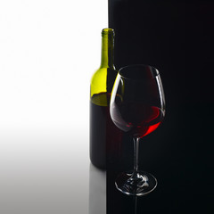  bottle and glass with red wine