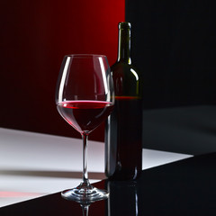  bottle and glass with red wine