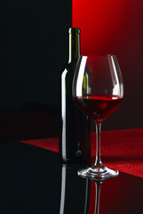  bottle and glass with red wine