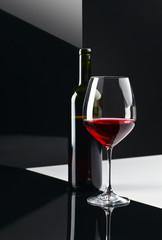  bottle and glass with red wine
