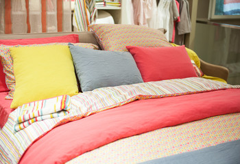 Colorful pillows on bedroom