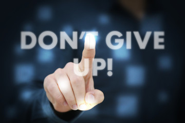Businessman touching Don't Give Up!