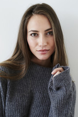 Gorgeous woman in gray sweater, portrait