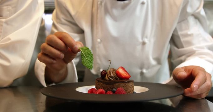 Chefs putting finishing touch on desserts