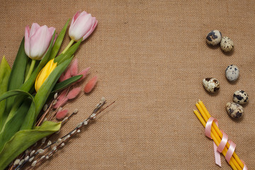 Easter postcard. Easter eggs and candles on the table