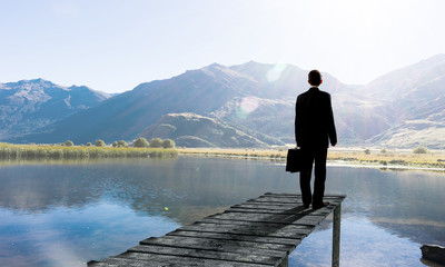 Fototapeta premium Businessman stand on berth