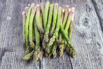 Green asparagus on wooden background