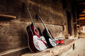  guitar on a wooden porch