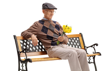 Stood up senior sitting on a bench