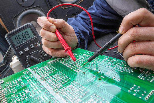 Checking circuit by Multimeter. Electrical engineer on during ch