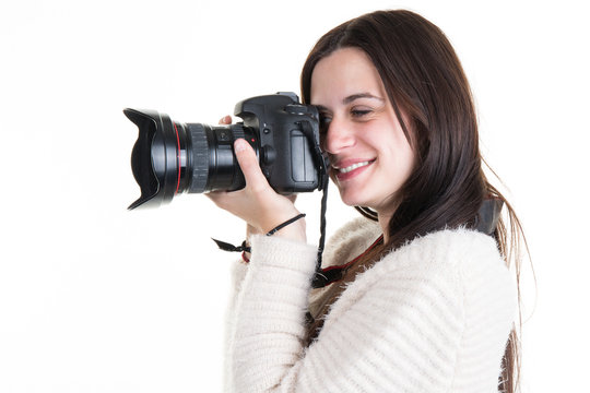 Profile view of Female Photographer Shooting someone in studio