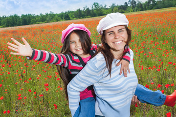 Vintage family on the poppy meadow