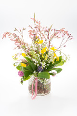 beautiful bouquet of bright wild flowers and lily isolated on white