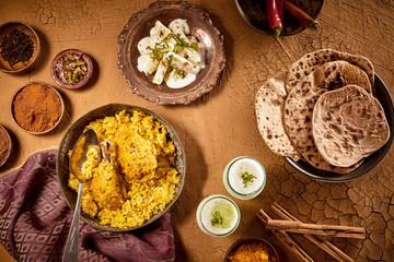 Curried chicken with bread and sauces