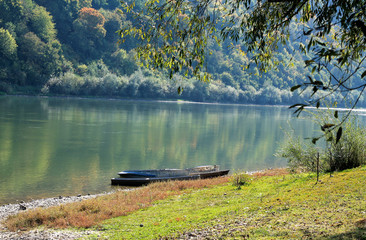 The boat on the river bank in a quiet backwater