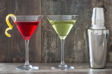 Cocktails and shaker on wood
