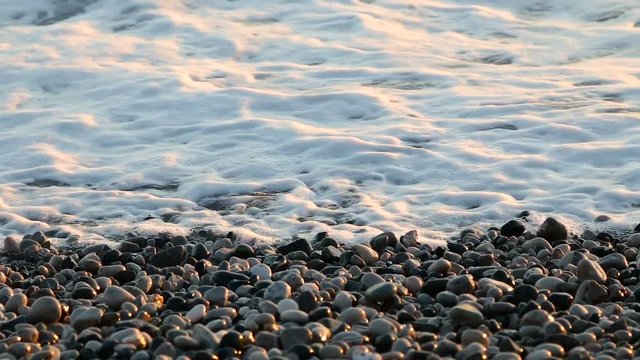 waves of the sea at pebble