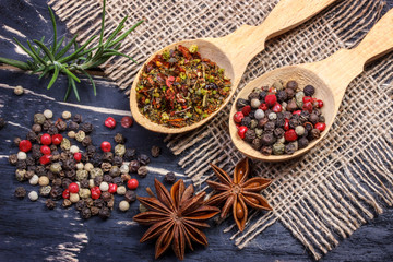 Colorful aromatic Indian spices and herbs on an old oak wooden brown background
