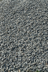 little crushed stone, grey macadam close-up; background;
