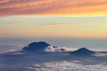 Sunset over the clouds. beautiful background with clouds and mou