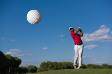 golf player hitting long shot