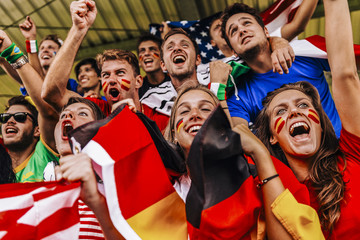 Obraz premium Supporters from Multiple Countries at Stadium All Together